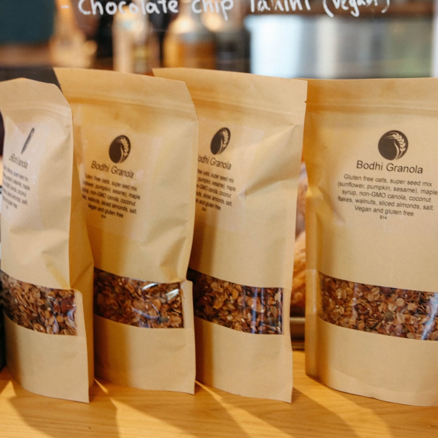 Bodhi granola packaged in kraft paper bags at the market